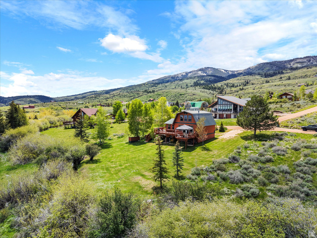 371 Lewis Loop, Unit 29 Fish Haven, ID 83287 - Photo 12 of 40 Residence featuring a barn-style roofline and multi-level wooden decking
