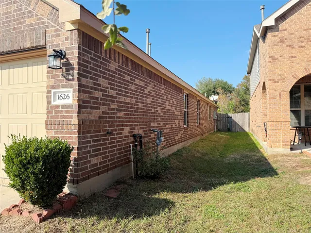 a view of a backyard with plants