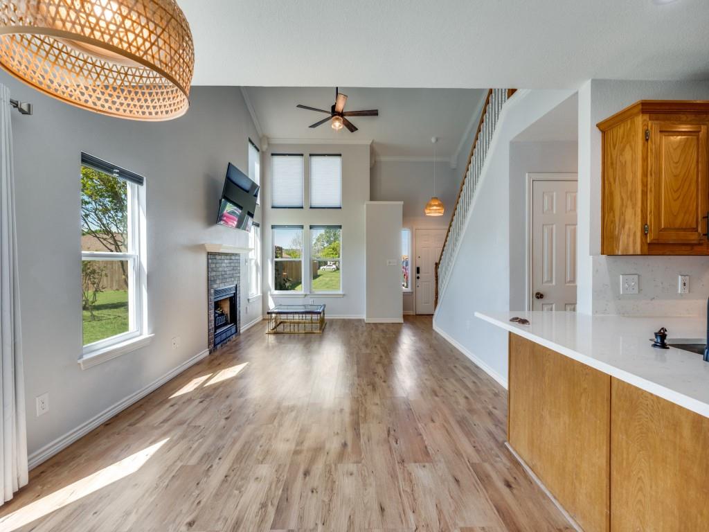 401 North Sierra Trail Pilot Point, TX 76258 - Photo 11 of 30 wooden floor in an empty room with a window