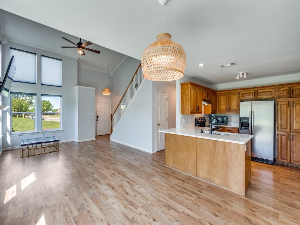 401 North Sierra Trail Pilot Point, TX 76258 - Photo 12 of 30 a view of a kitchen with furniture and a window