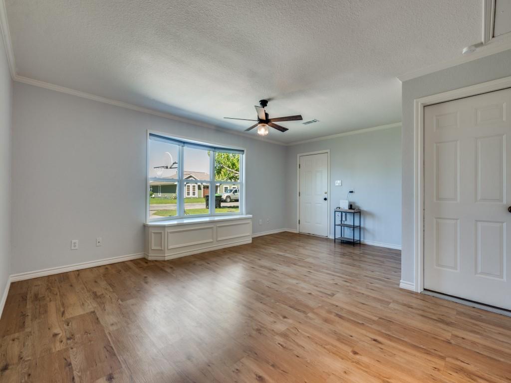 401 North Sierra Trail Pilot Point, TX 76258 - Photo 17 of 30 wooden floor in an empty room with a window