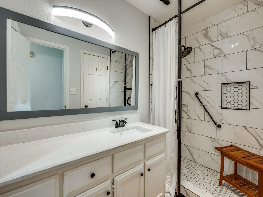 401 North Sierra Trail Pilot Point, TX 76258 - Photo 20 of 30 a bathroom with a sink and a mirror