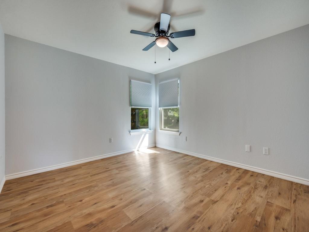 401 North Sierra Trail Pilot Point, TX 76258 - Photo 21 of 30 wooden floor in an empty room with a window