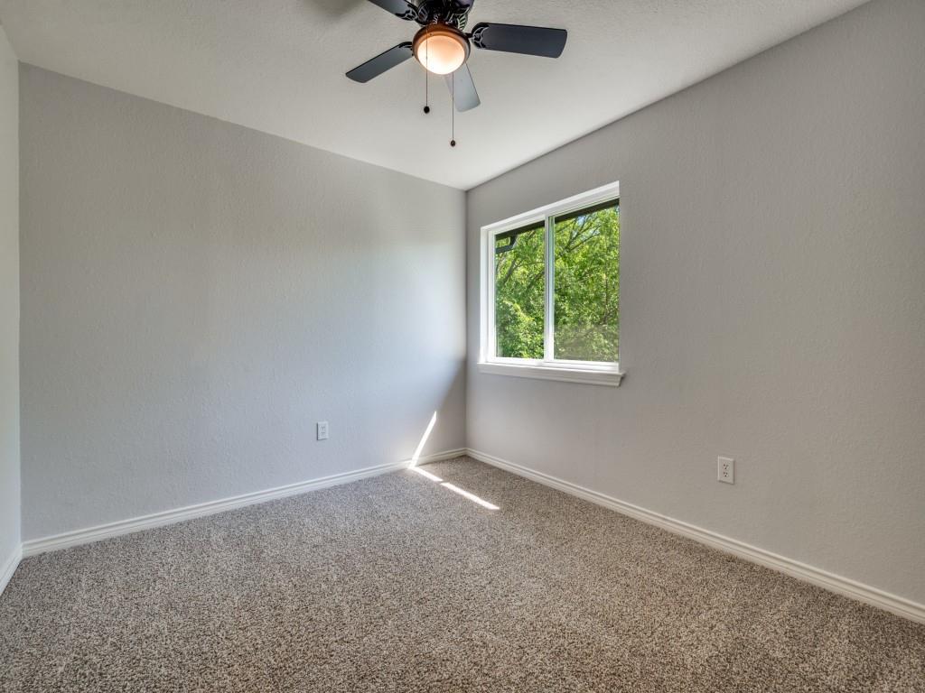 401 North Sierra Trail Pilot Point, TX 76258 - Photo 22 of 30 an empty room with a window and a fan