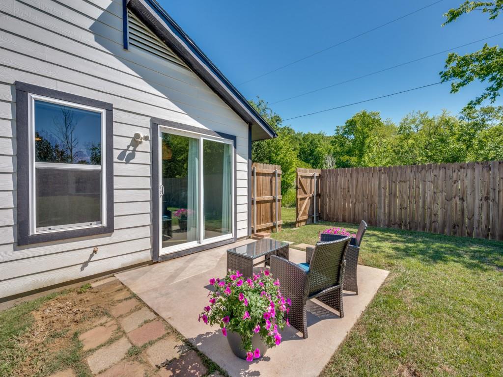 401 North Sierra Trail Pilot Point, TX 76258 - Photo 25 of 30 a backyard of a house with yard and outdoor seating