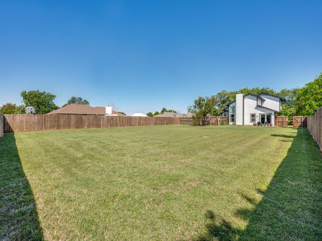401 North Sierra Trail Pilot Point, TX 76258 - Photo 26 of 30 a huge green field with lots of bushes