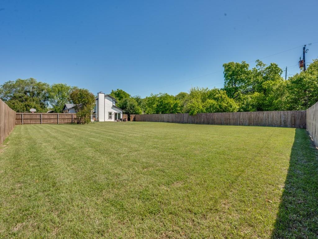 401 North Sierra Trail Pilot Point, TX 76258 - Photo 28 of 30 a view of a yard with a house in the background