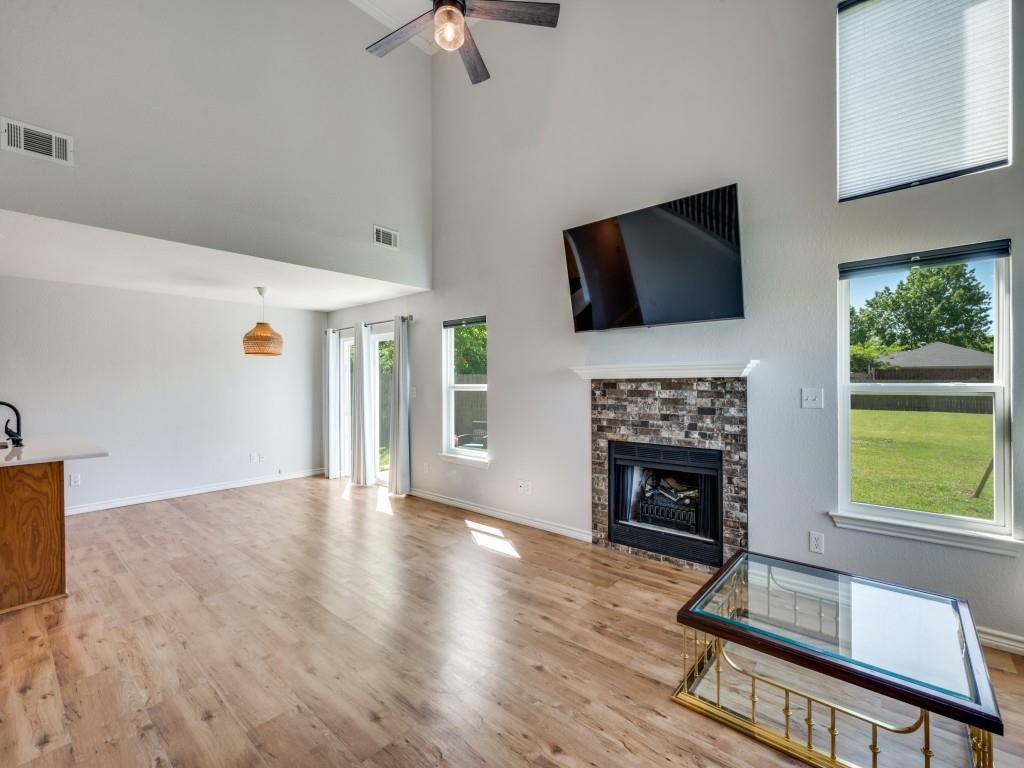 401 North Sierra Trail Pilot Point, TX 76258 - Photo 9 of 30 a living room with furniture fireplace and flat screen tv