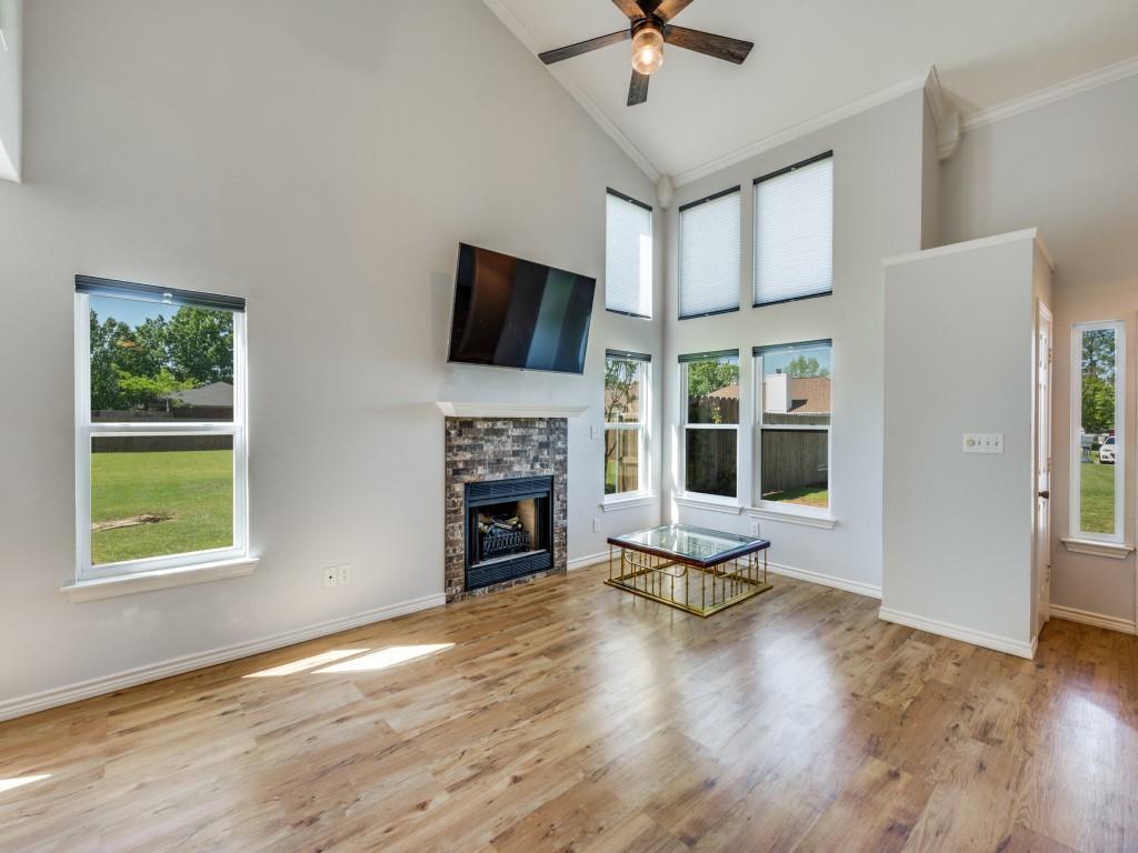 401 North Sierra Trail Pilot Point, TX 76258 - Photo 10 of 30 a living room with furniture fireplace and flat screen tv
