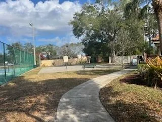 a view of a patio with table and chairs with wooden fence and plants