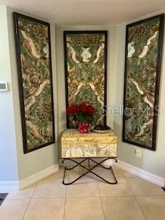 a bed sitting in a room next to a window