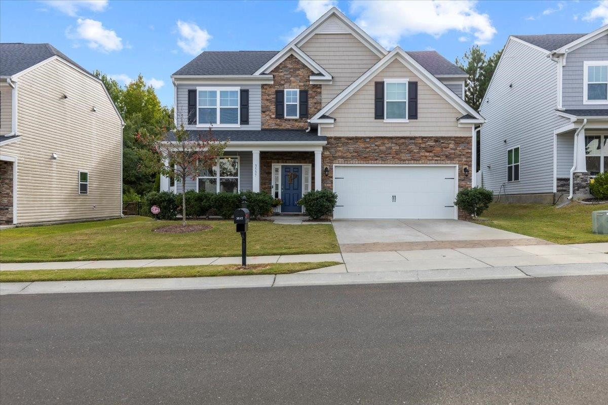 a view of house with yard and street view