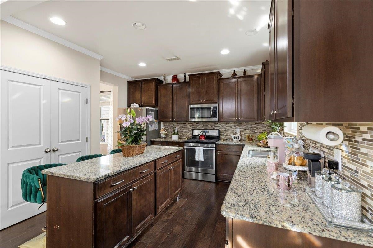 3537 Massey Ridge Court Raleigh, NC 27616 - Photo 11 of 41 a kitchen with granite countertop lots of counter top space