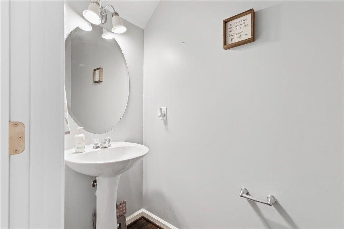 3537 Massey Ridge Court Raleigh, NC 27616 - Photo 19 of 41 a bathroom with a sink and a mirror