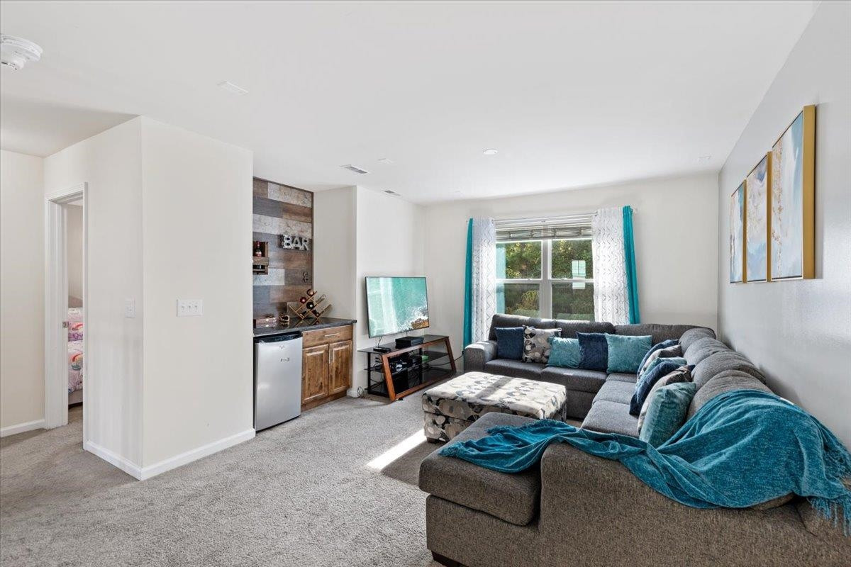 3537 Massey Ridge Court Raleigh, NC 27616 - Photo 23 of 41 a living room with furniture and a window
