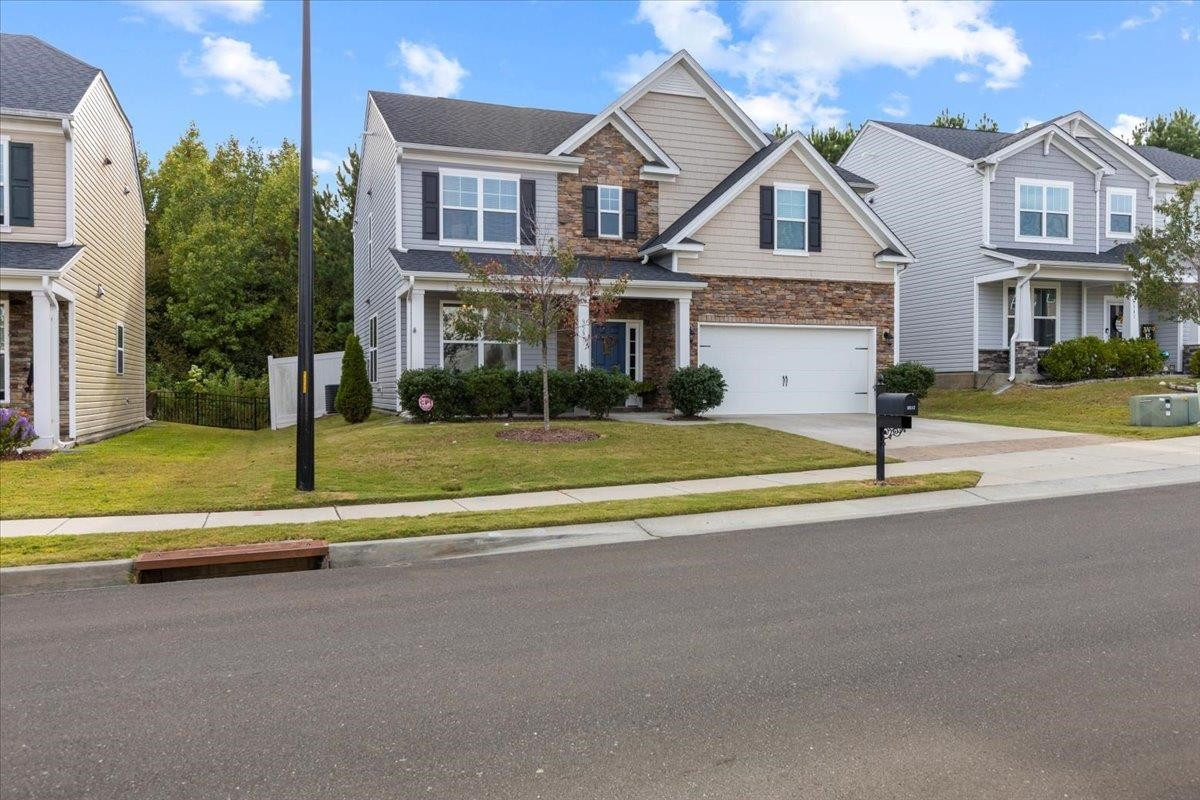 3537 Massey Ridge Court Raleigh, NC 27616 - Photo 39 of 41 a front view of a house with a yard