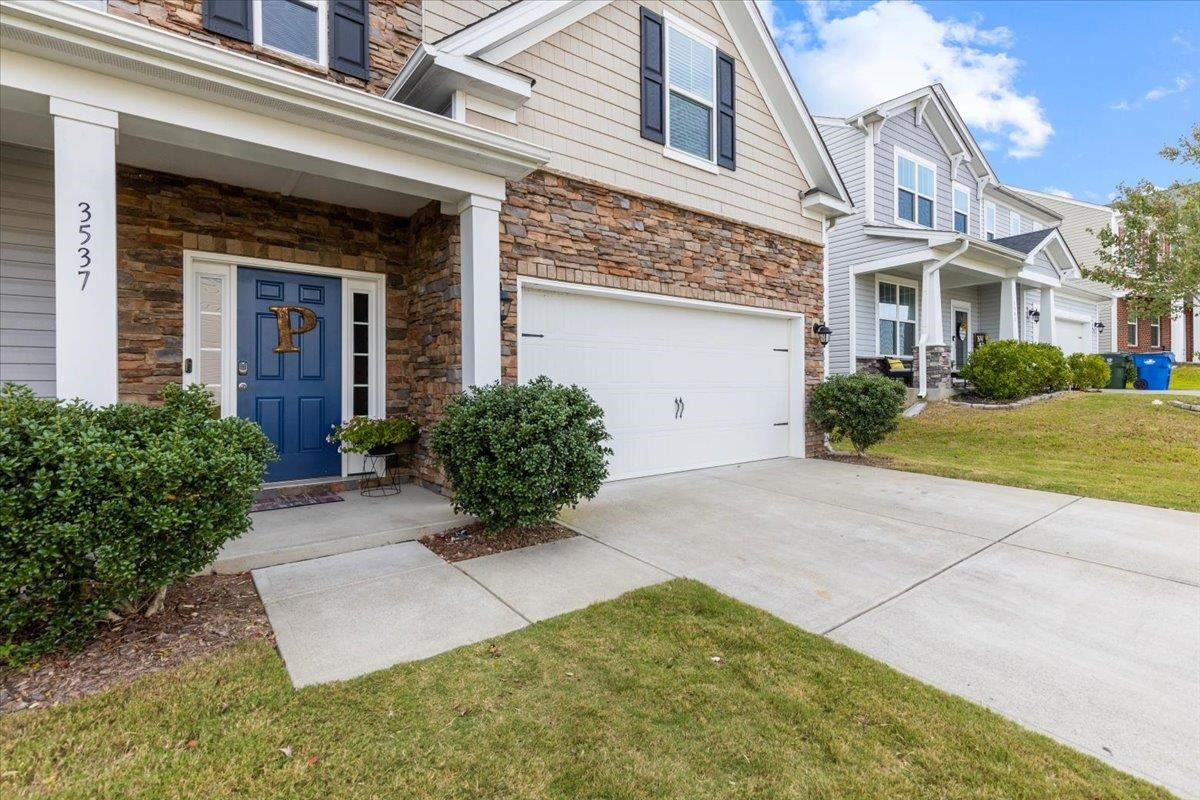 3537 Massey Ridge Court Raleigh, NC 27616 - Photo 4 of 41 front view of a brick house with a yard