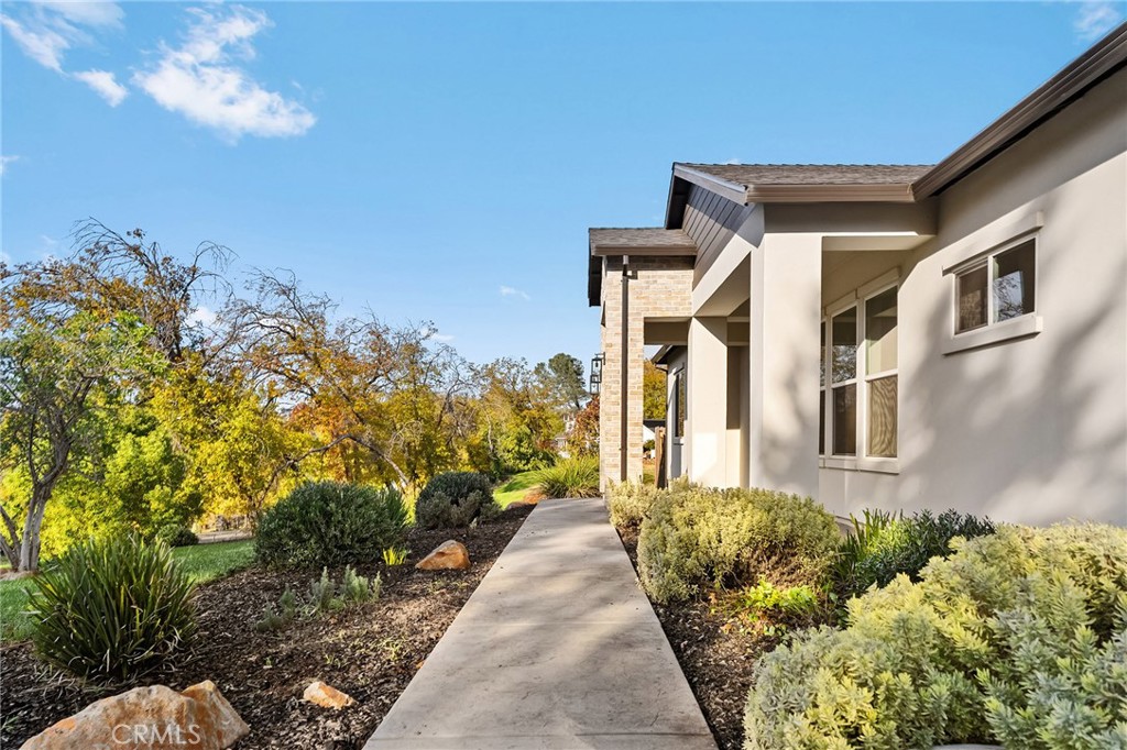 96 Valley View Drive Paradise, CA 95969 - Photo 13 of 47 a front view of a house with a yard and potted plants