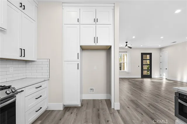 a view of a kitchen with wooden floor
