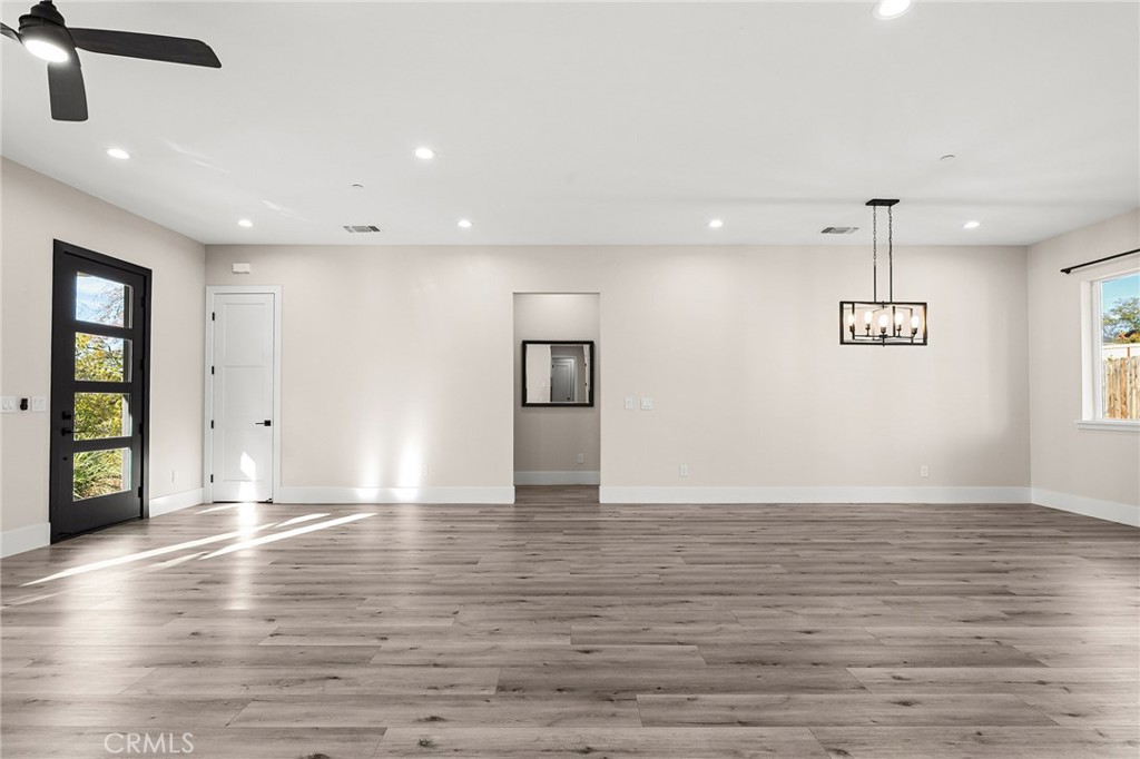 96 Valley View Drive Paradise, CA 95969 - Photo 23 of 47 a view of an empty room with window and wooden floor