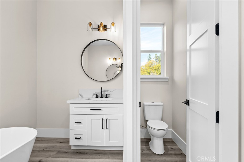 96 Valley View Drive Paradise, CA 95969 - Photo 28 of 47 a bathroom with a toilet a sink and mirror