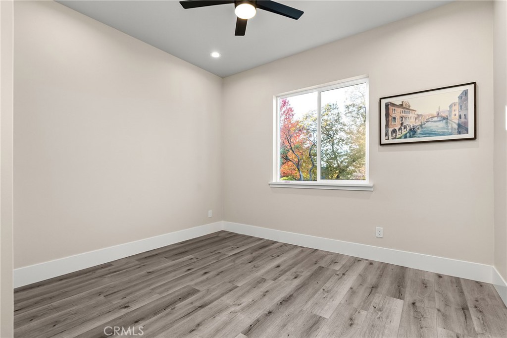 96 Valley View Drive Paradise, CA 95969 - Photo 31 of 47 an empty room with a window and wooden floor