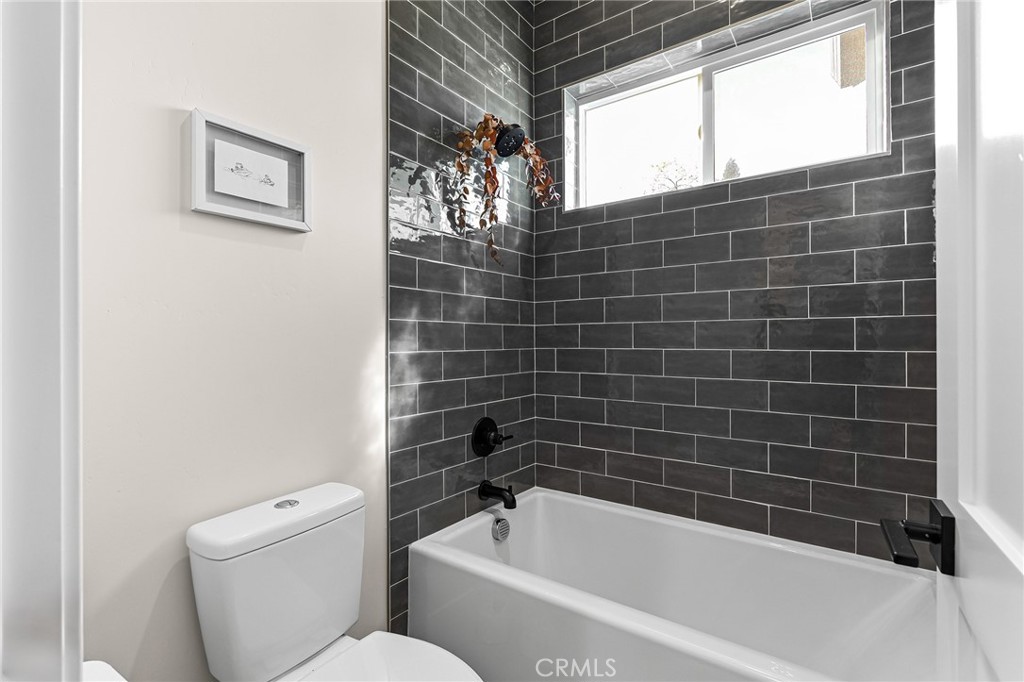 96 Valley View Drive Paradise, CA 95969 - Photo 34 of 47 a bathroom with a toilet and bathtub