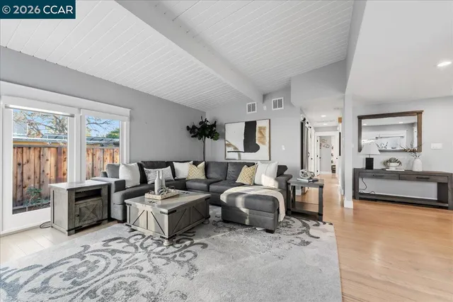 a living room with furniture and a couch