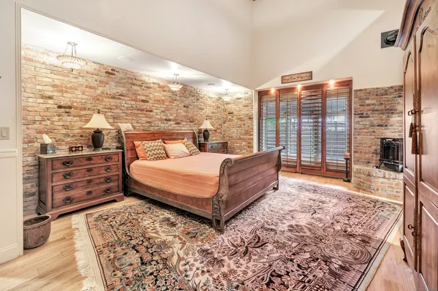 a bedroom with a large bed and a large window