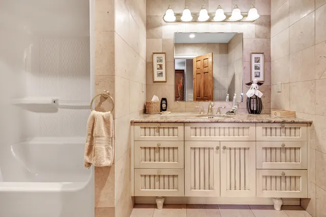 a bathroom with a bathtub and a sink