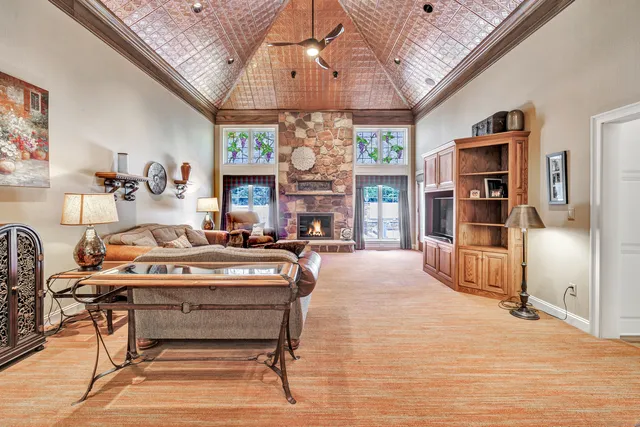 a view of a livingroom with furniture and a fireplace