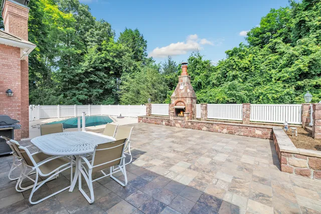 an aerial view of a house with a yard and garden