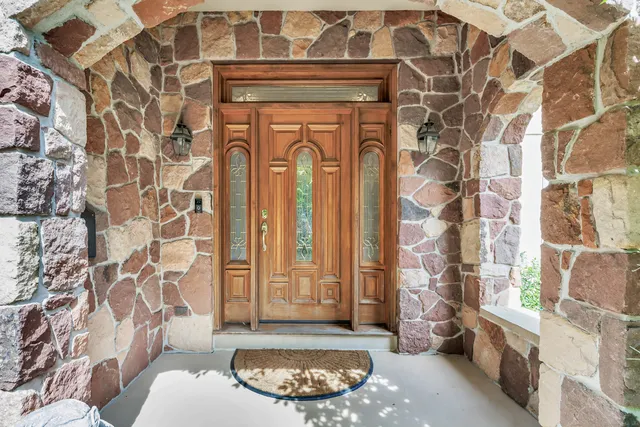 a living room with a couch and a fireplace