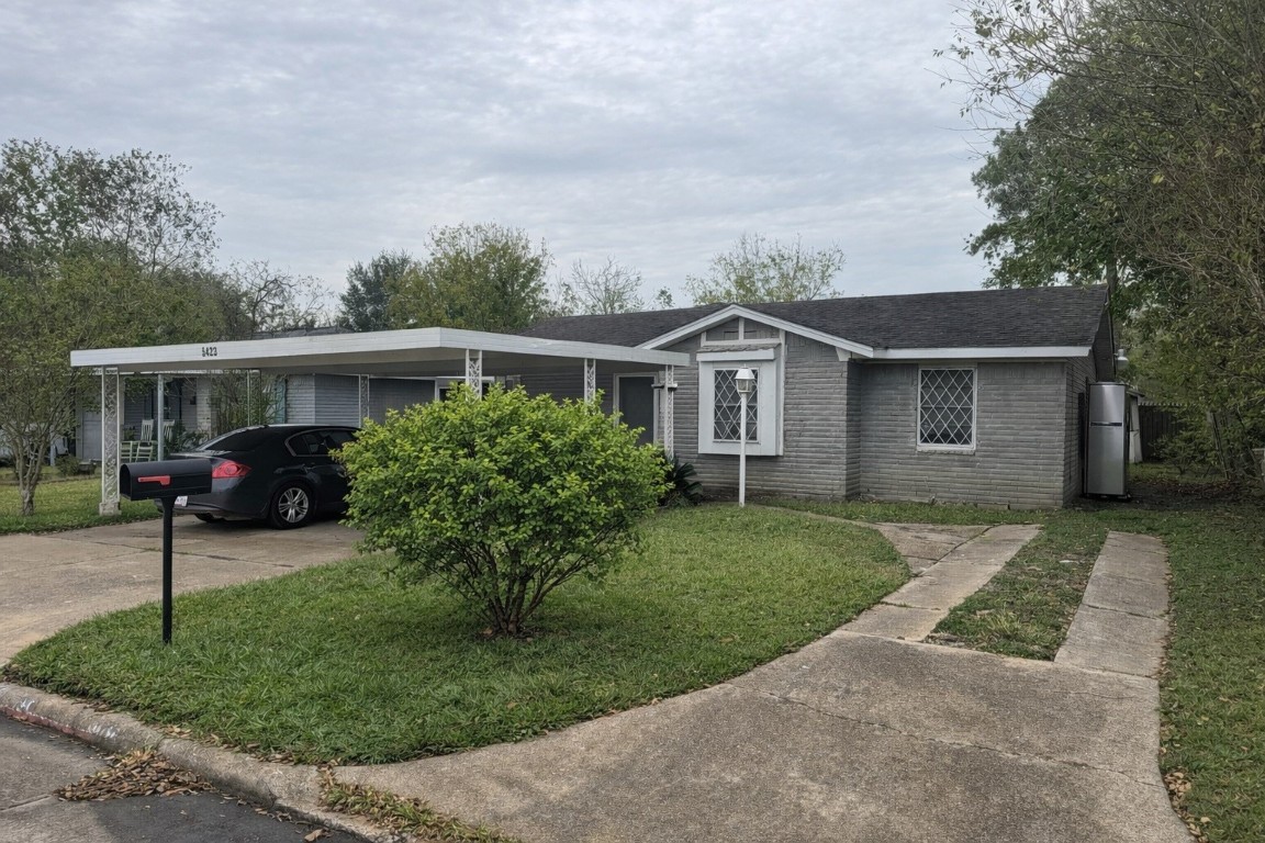 a view of a house with a garden