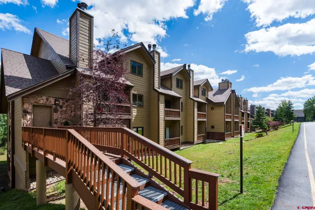 a view of a house with brick walls