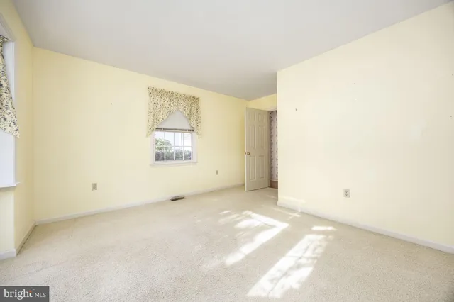 a kitchen with a sink and a mirror