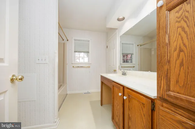 a bathroom with a toilet a sink and shower