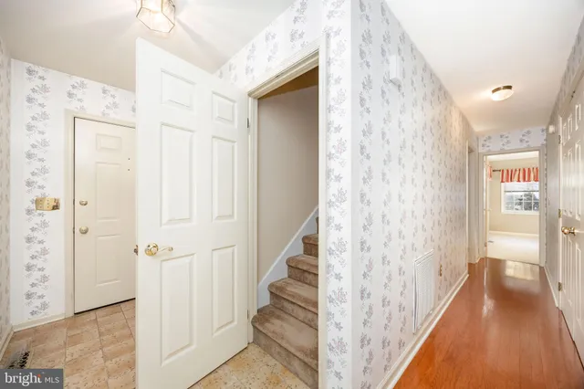 a view of a house with a yard and fence