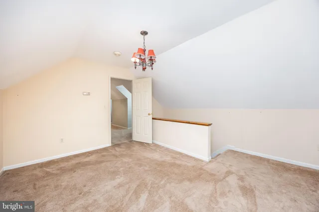 a view of staircase with large trees and wooden fence