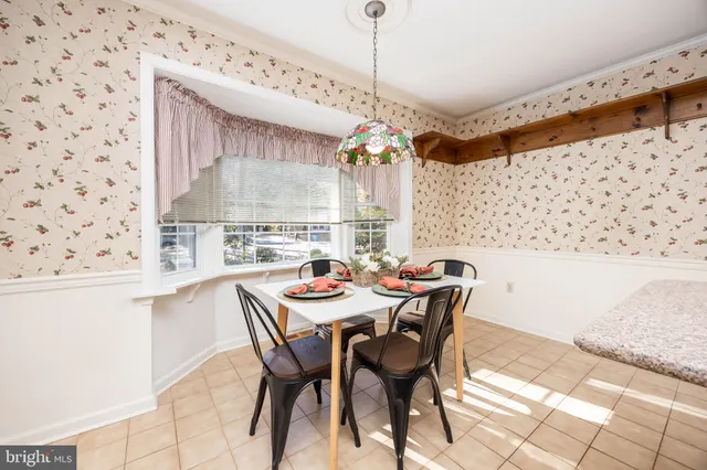 a kitchen with stainless steel appliances granite countertop a refrigerator a stove and a cabinets