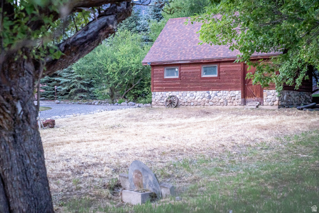 435 Canyon Road Millville, UT 84326 - Photo 87 of 113 Wood-sided outbuilding featuring a stone foundation and a shingle roof