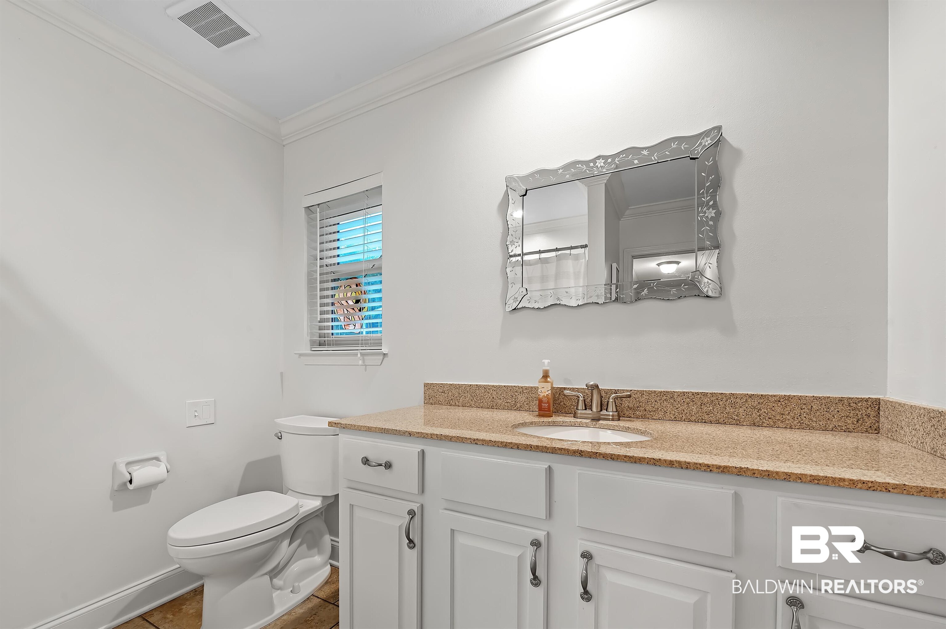 104 James Circle Daphne, AL 36526 - Photo 57 of 62 Bathroom featuring vanity, crown molding, toilet, and tile patterned flooring