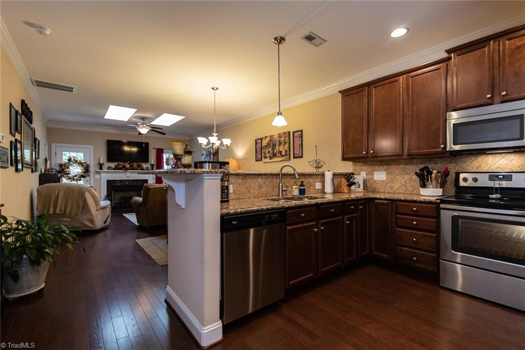 660 Nikyle Circle High Point, NC 27265 - Photo 8 of 27 Open concept kitchen, dining and living area