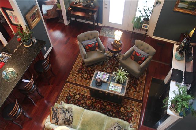 3700 Pondywood Road Adams, TN 37010 - Photo 4 of 20 The living room has beautiful Brazilian cherry hardwood flooring, plenty of natural light! The space opens to the kitchen and sitting room/breakfast area. Very functional!