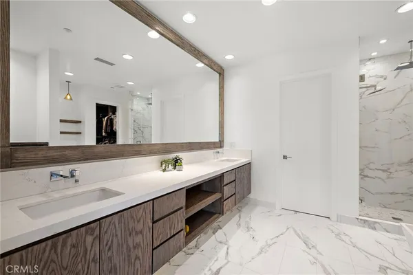 a bathroom with a sink vanity and a mirror