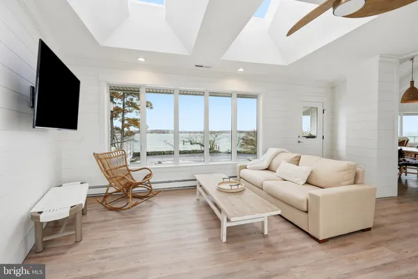 a view of a lake with a house in the background