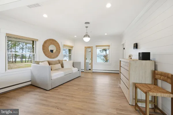 an aerial view of a house with a lake view