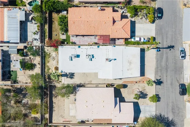 an aerial view of residential houses with outdoor space