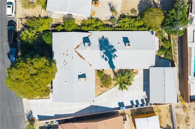 an aerial view of a house with a swimming pool