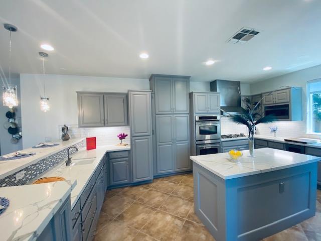 3497 Foxmore Lane Rescue, CA 95672 - Photo 16 of 83 a kitchen with stainless steel appliances granite countertop a sink and a refrigerator